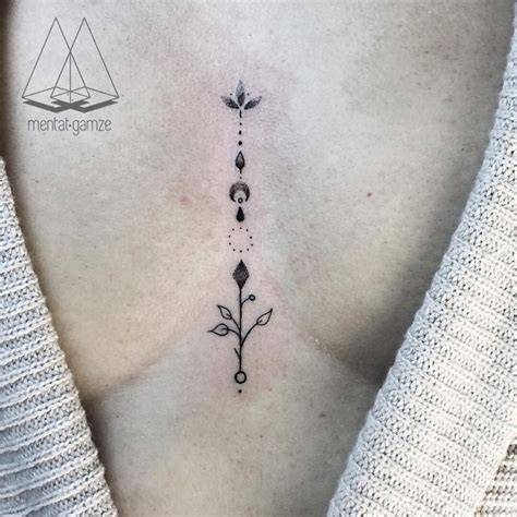 Small between breast tattoo simple